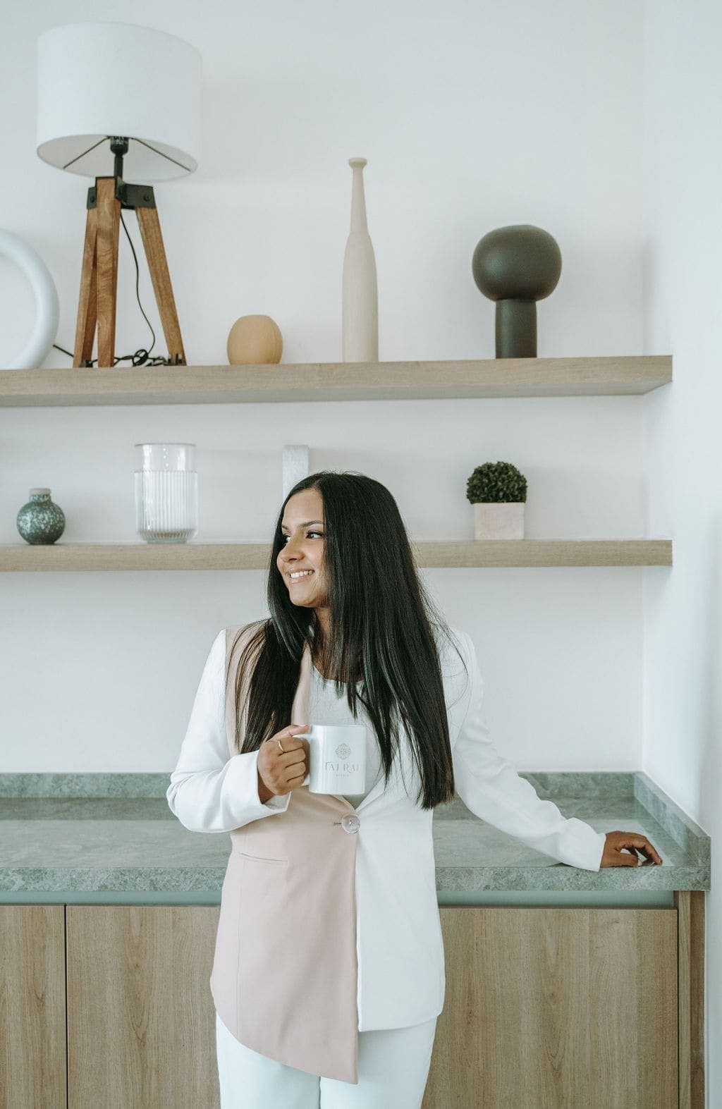 Tajrean Kashem, founder of Taj Raj Events, with a coffee at home