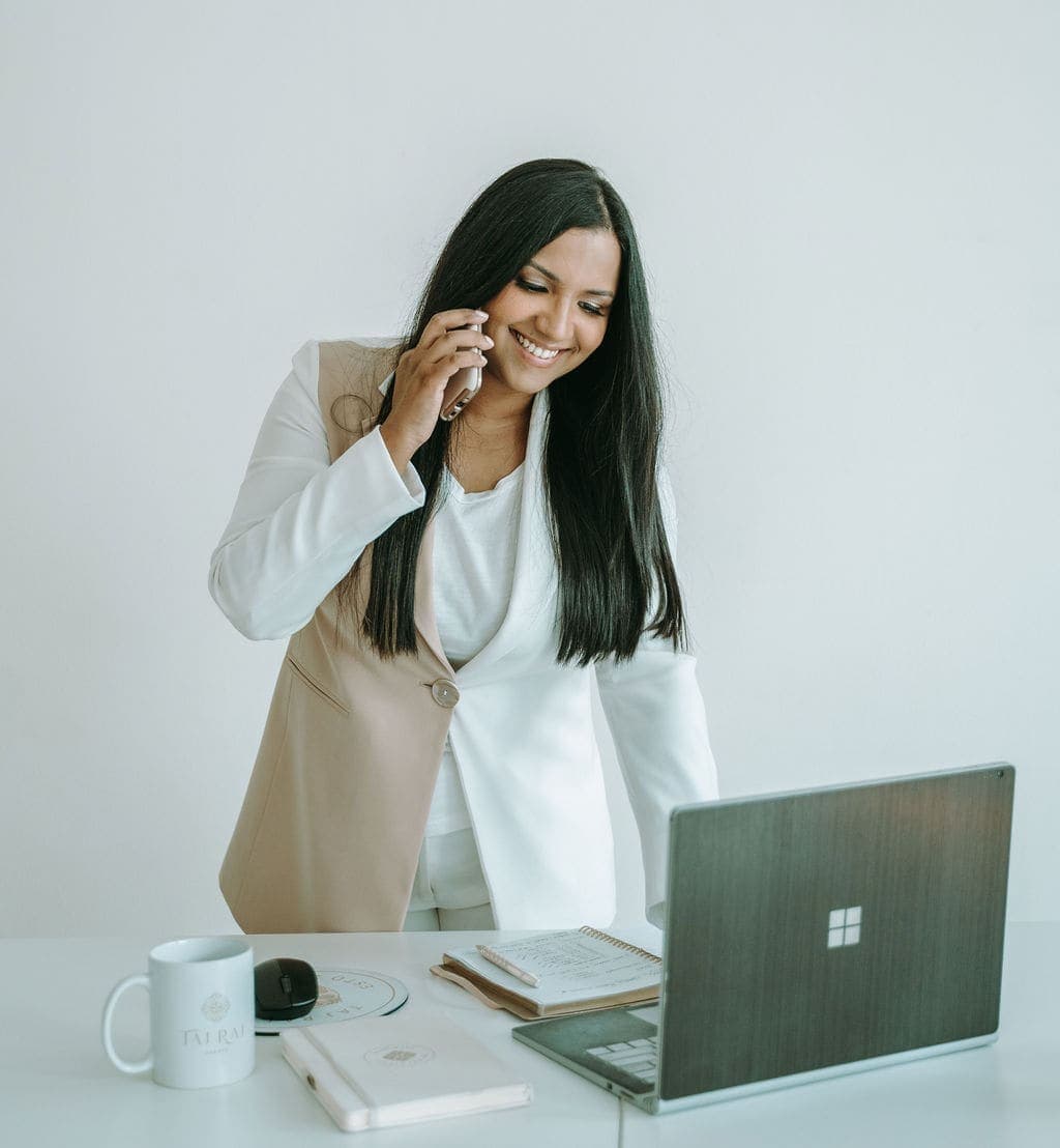 Tajrean Kashem taking a client call at her desk